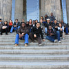 Group picture of the SPRING students sitting on stairs.