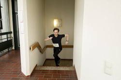A man jogs up a staircase