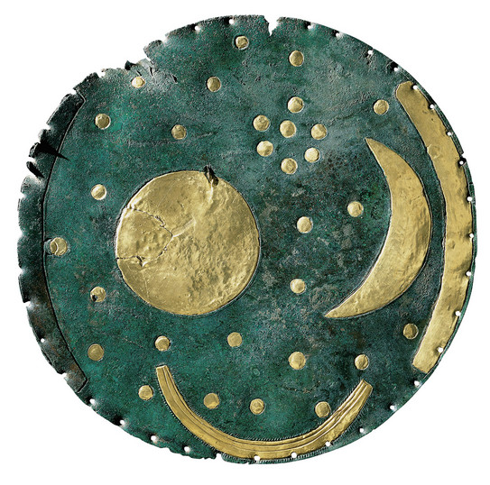 An image of a sky disc showing stars, moons and planets.