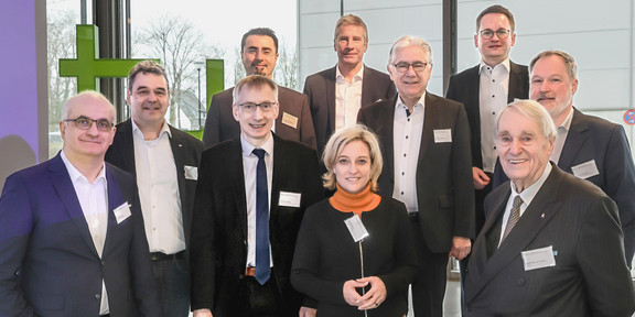 A group of people at the opening of the Competence Center for Digital Production Technologies in the Rudolf Chaudoire Pavilion at TU Dortmund University. 