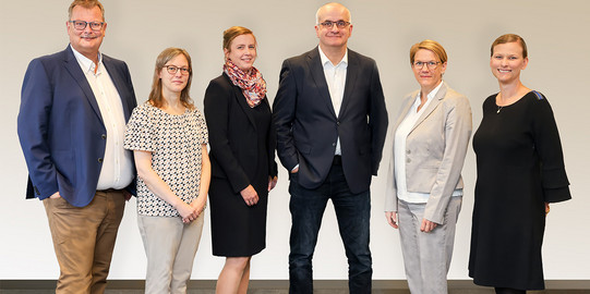 A photo of the TU Dortmund University rector's office, two men and four women in formal attire.