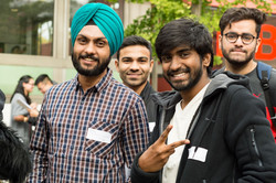 Four international students in front of the International Meeting Center IBZ
