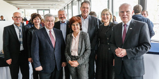 Group photo with five men and three women