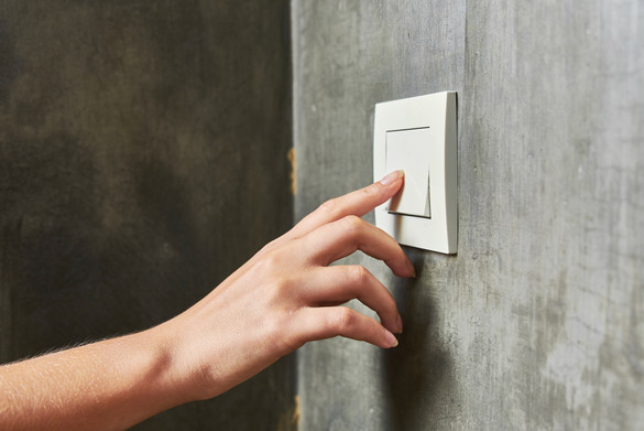 Person operates light switch