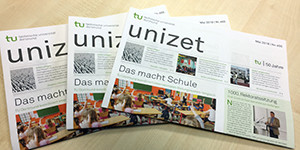unizet Drei Ausgaben der unizet liegen aufgefächert auf einem Tisch