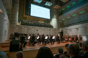 View of choir and orchestra playing on stage