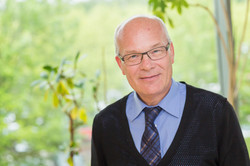 A man smiles at the camera