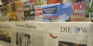 Different newspapers side by side. 