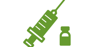 A green syringe and vaccine