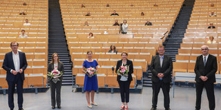 Group photo of the elected Rectorate in a lecture hall.