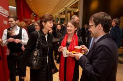 Three people in conversation