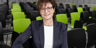 Portrait picture of a woman, this woman is Prof. Gabriele Sadowski sitting on a chair.