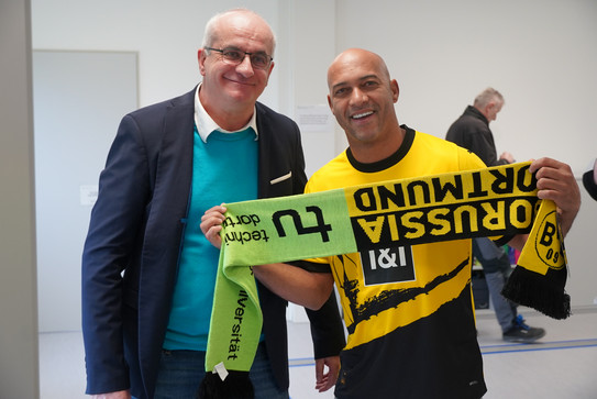 Bayer and Dedê with a TU and Borussia Dortmund fan scarf
