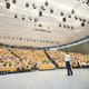 A man is speaking to an audience in a large lecture hall