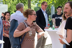 Guests outside at bar tables in conversation