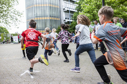 Children run across the campus