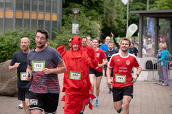 Runners at the campus run, some in costume