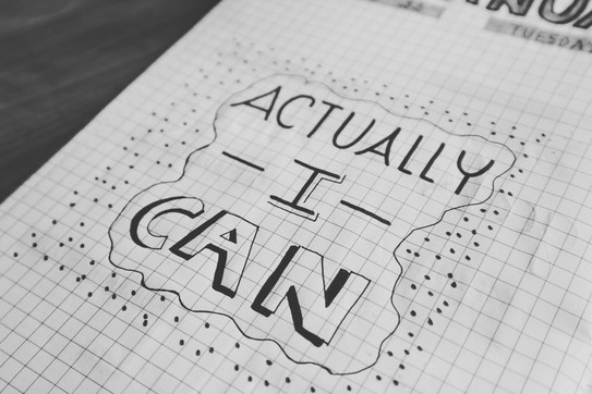 On a squared sheet of paper, “Actually I can” is written and outlined with a line and dots.
