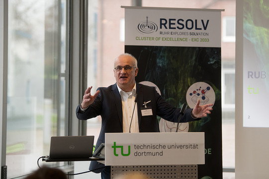 A man stands at a lectern and gives a speech