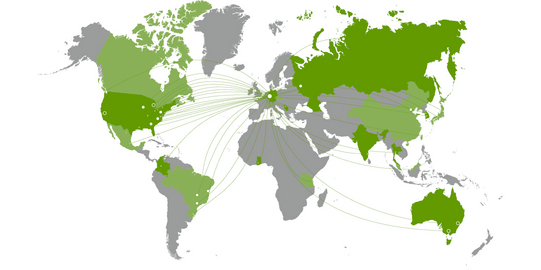 Graphic design of a green and gray world map without country names. Countries with cooperating universities are shown in green.
