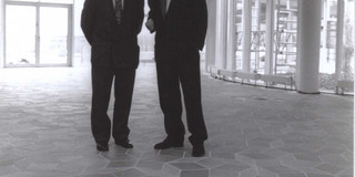 Two men in the foyer of the Audimax