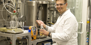 Man with safety goggles in a laboratory