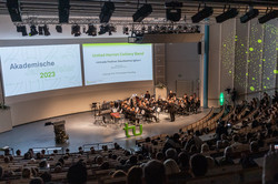 An orchestra plays on stage