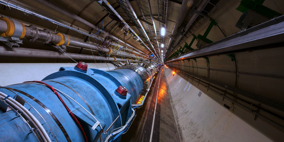 LHC tunnel LHC tunnel with a long tube under the ground.