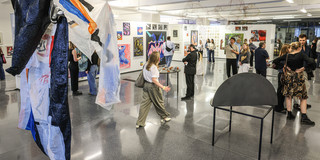 Photo: Exhibition at the Dortmunder U. The photo shows various works of art and people viewing the exhibition.