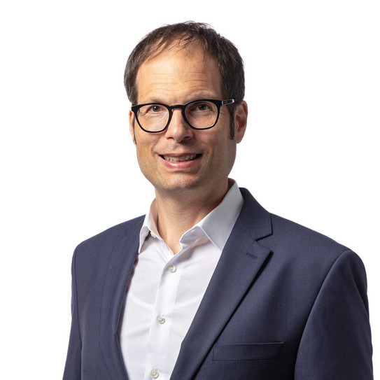 Marcus Ricker Portrait picture of a man in a suit