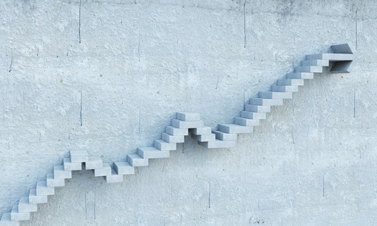A chart going upwards made out of stairs.