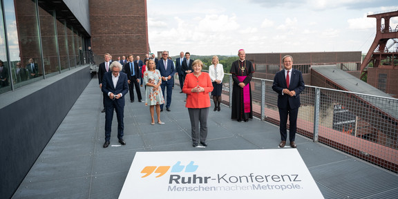 Group photo with Angela Merkel and Armin Laschet.