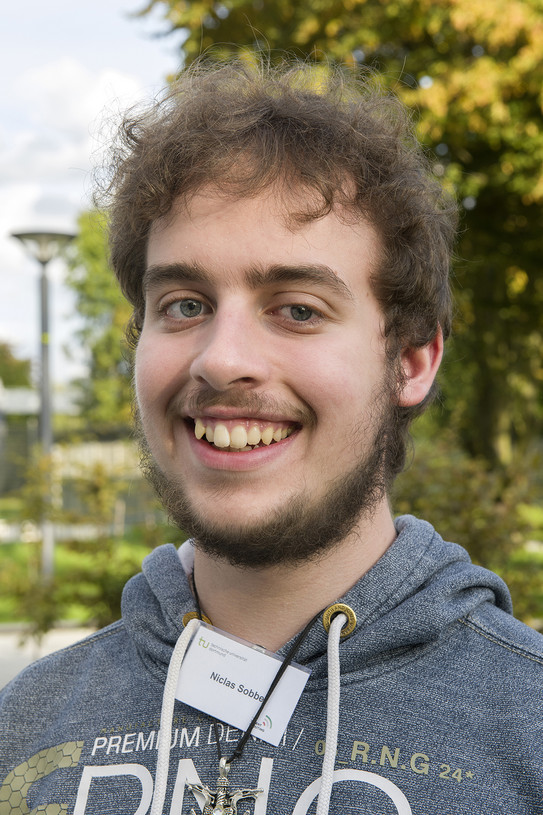 Portraitfoto eines jungen Mannes.