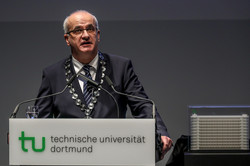 Manfred Bayer stands at the lectern