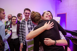 Two people hug each other