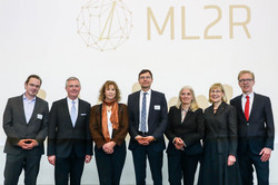Group photo, in the background you can read "ML2R" next to a logo