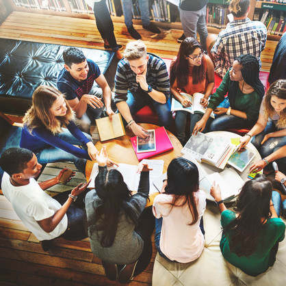 Group of students sitting in sofa corner