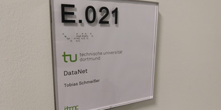 A door sign with the name of Tobias Schmeißer