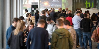 People stand together at the RESOLV New Year's reception.