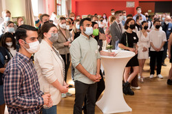 View into the audience at the Global Gallery, all persons wear masks