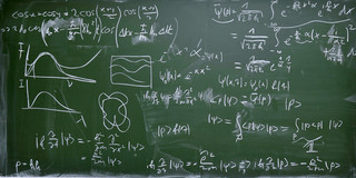 Mathematical formulas are written on a blackboard