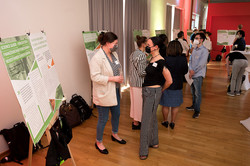 Guests view the poster presentation