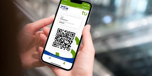 Digital student ID card Two hands hold a smartphone whose screen displays a QR code