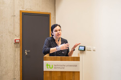 A woman speaks at a lectern