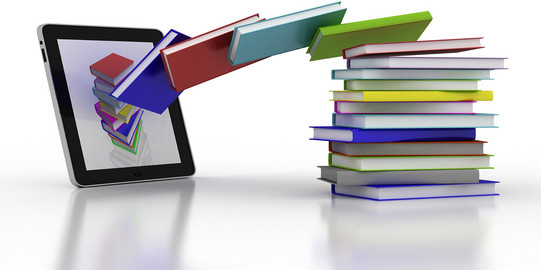 literature upload Books seem to fly into a tablet.