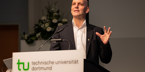 A man stands at a podium and gives a speech.