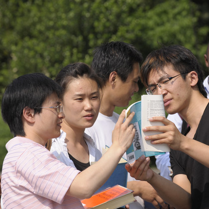A group of international students talk to each other.