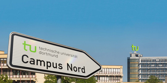 Signpost Campus North A street sign with directions to Campus North points in the direction of maths tower.