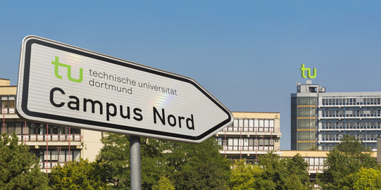 A street sign with directions to Campus North points in the direction of maths tower.