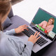 Woman with laptop is having a video call